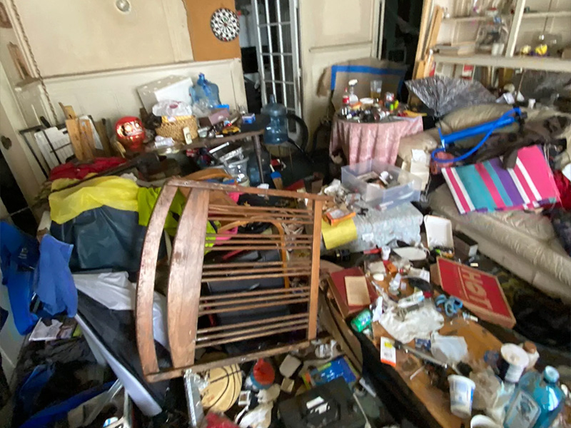 Cluttered room in need of cleanout and removal services