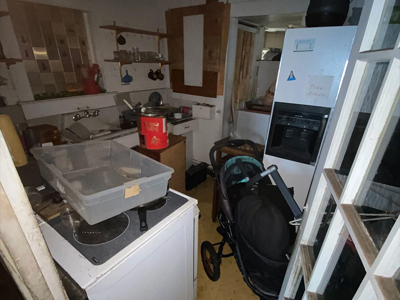 Cluttered kitchen needed for cleanout and appliance removal